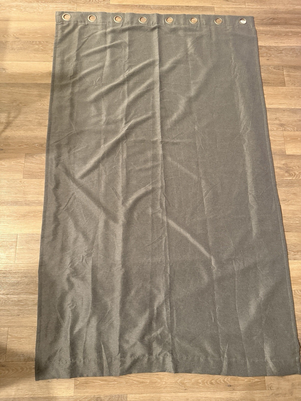grey polyester and viscose curtains with a plastic grommet top. Black Out Type.